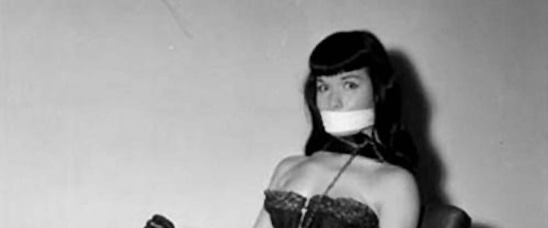 Bettie Page: Bondage Queen background 2