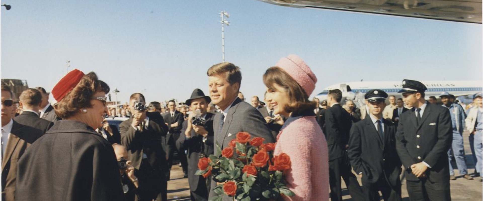 JFK Revisited: Through The Looking Glass background 1